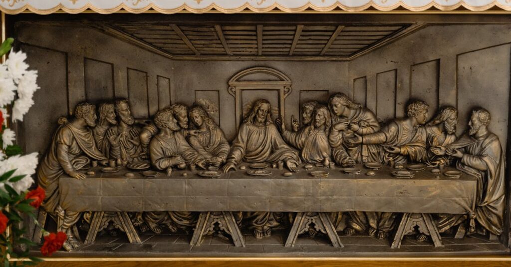Close-up view of a detailed Last Supper metal relief sculpture, symbolizing a famed biblical scene.